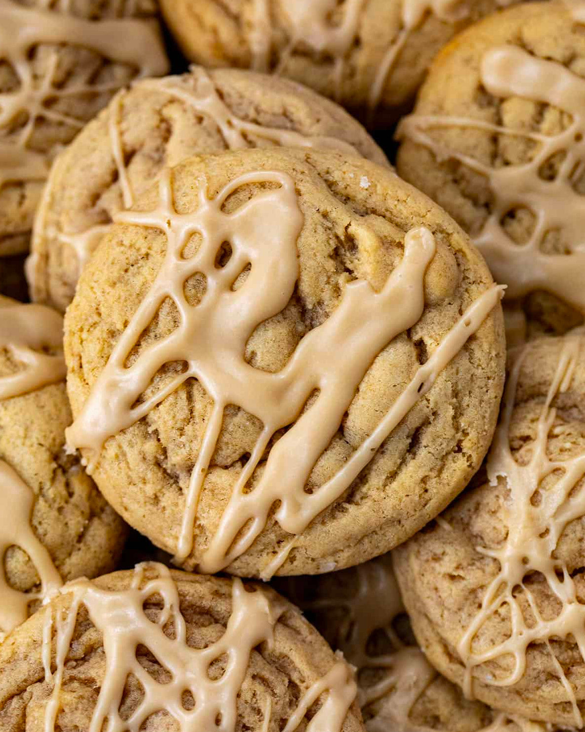 Cookies with a drizzled icing on top, stacked together